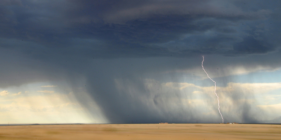 tornado clouds and a streak of lightning touching the ground